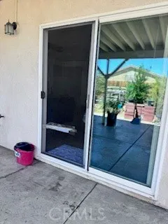 a view of a garage with a patio