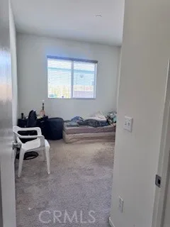 a room with a bed and a window