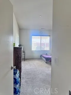 a view of a hallway with windows