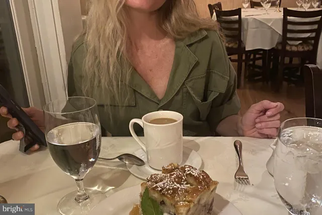 a picture of a bench in front of a wall