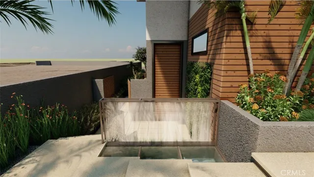 a view of a yard with plants and a bench