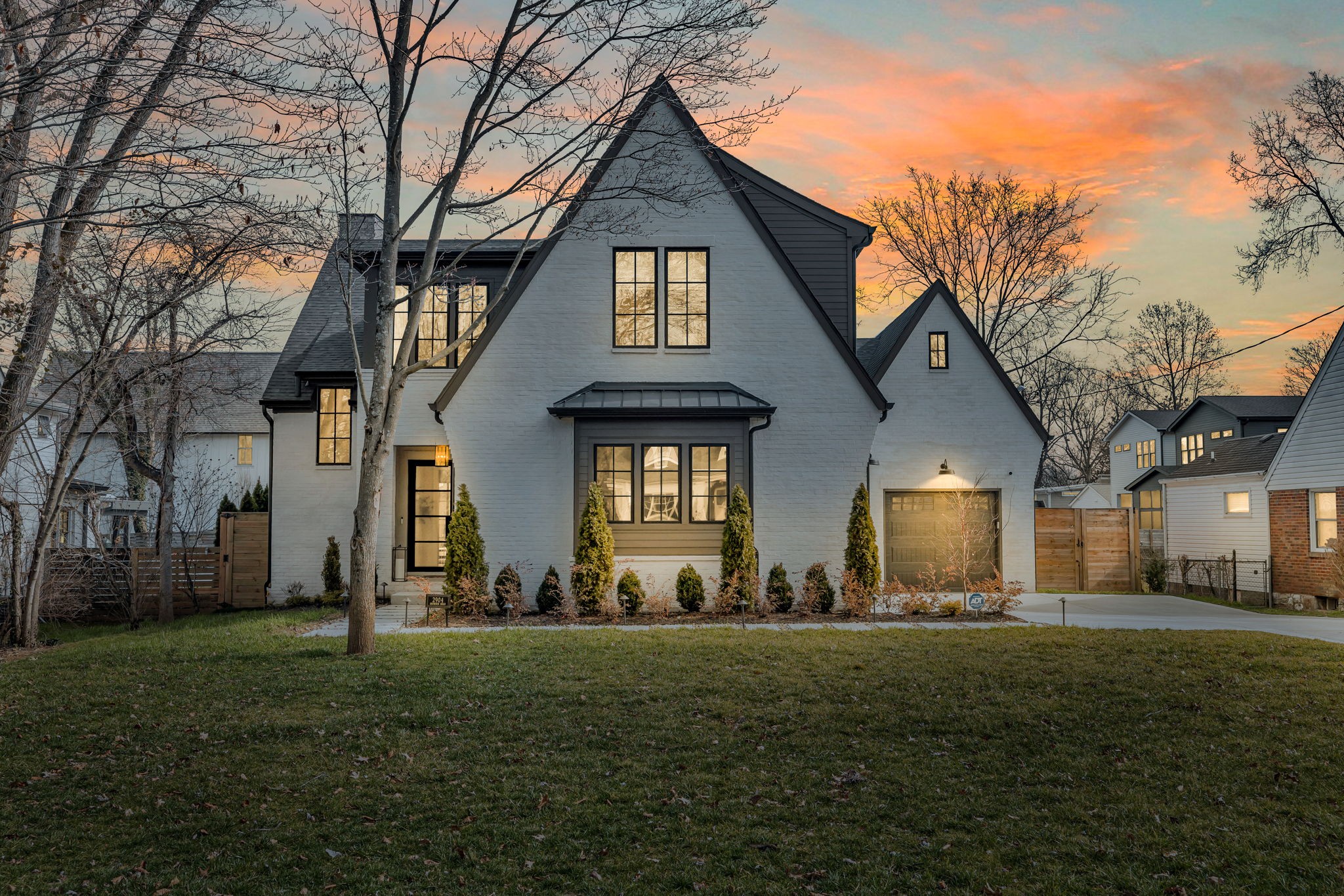a front view of a house with a yard