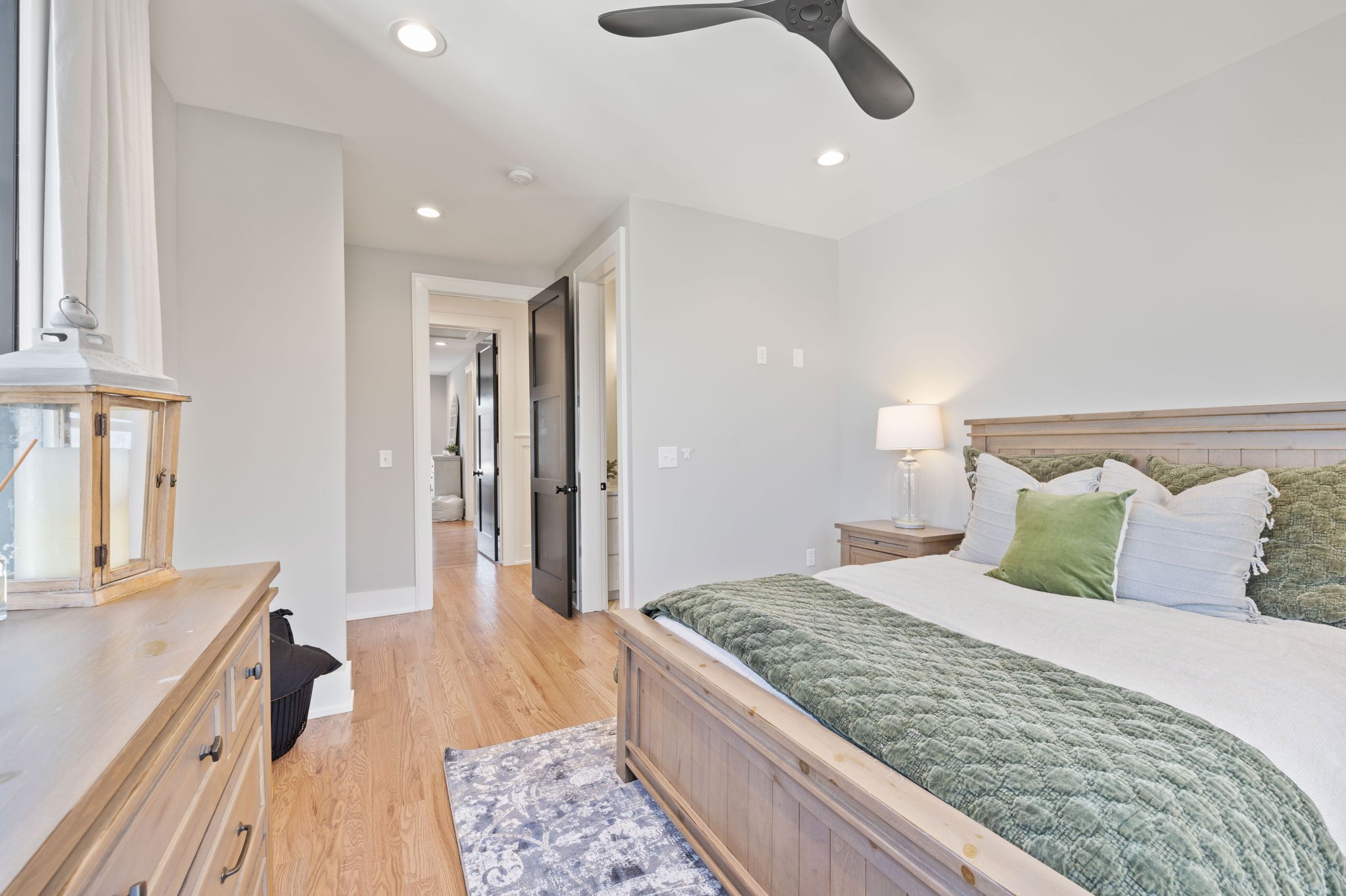 2904 Snowden Road Nashville, TN 37204 - Photo 49 of 69 a bedroom with a large bed and a chandelier