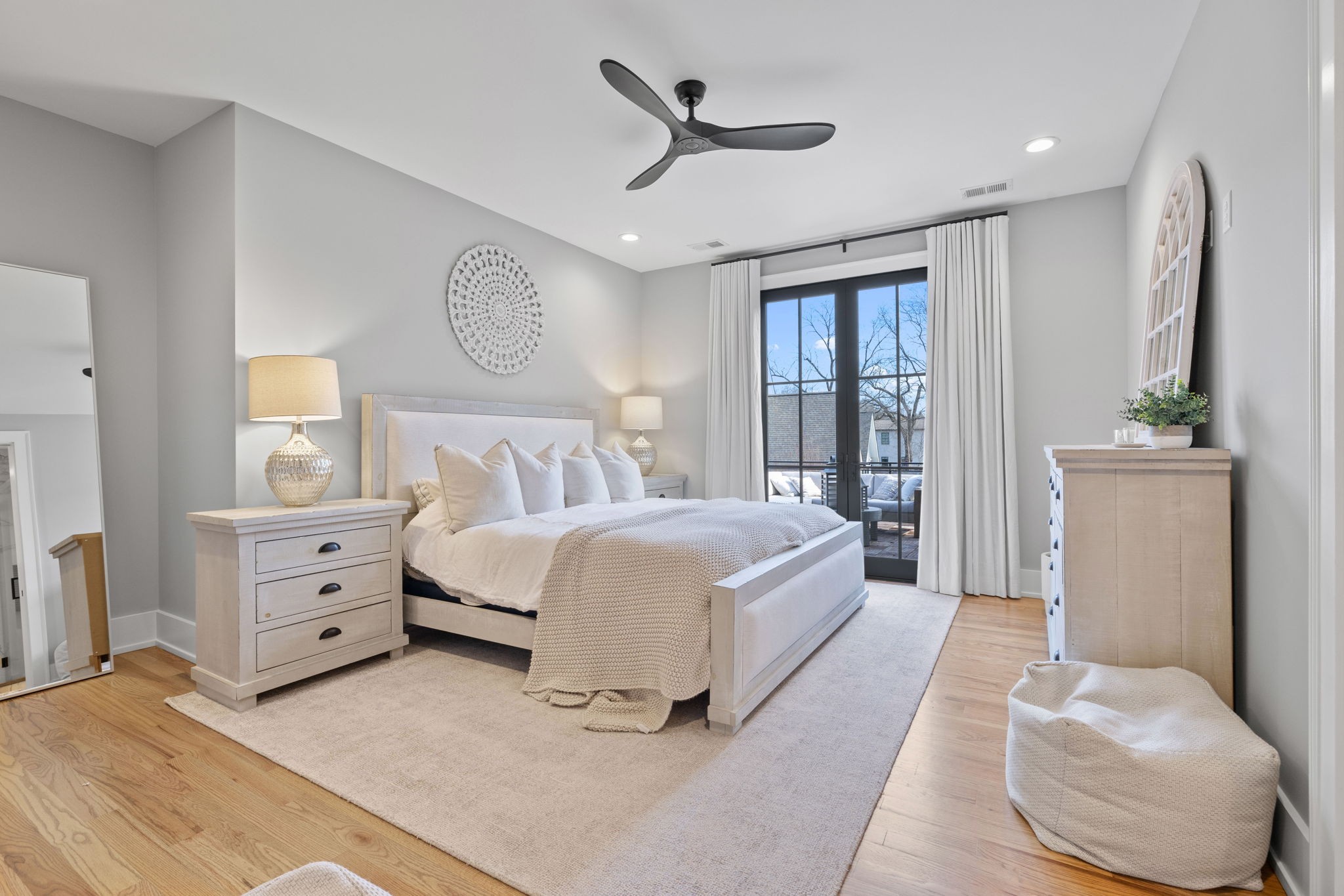 2904 Snowden Road Nashville, TN 37204 - Photo 50 of 69 a spacious bedroom with a bed and a chandelier