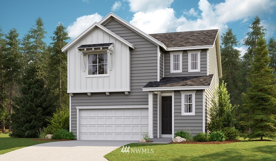 9779 Prospect Place Gig Harbor, WA 98332 - Photo 1 of 22 a front view of a house with a garden
