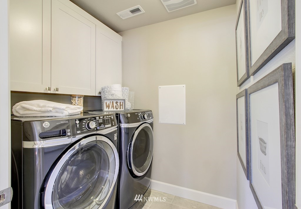 9779 Prospect Place Gig Harbor, WA 98332 - Photo 14 of 22 a utility room with dryer and washer