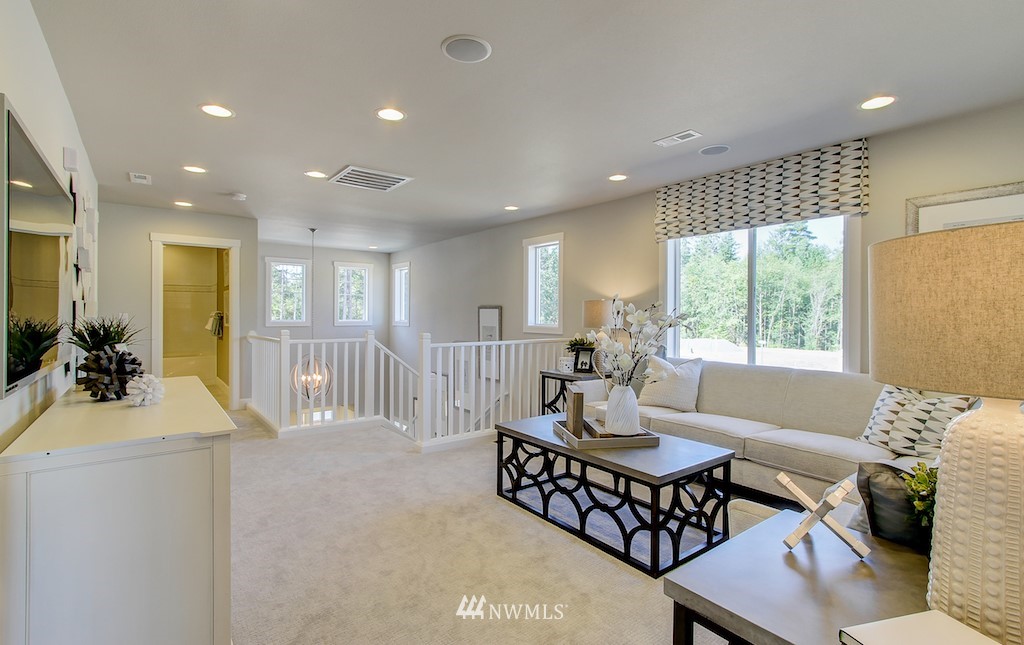 9779 Prospect Place Gig Harbor, WA 98332 - Photo 20 of 22 a living room with furniture and a large window