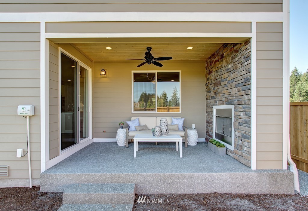 9779 Prospect Place Gig Harbor, WA 98332 - Photo 21 of 22 a living room with furniture and a window