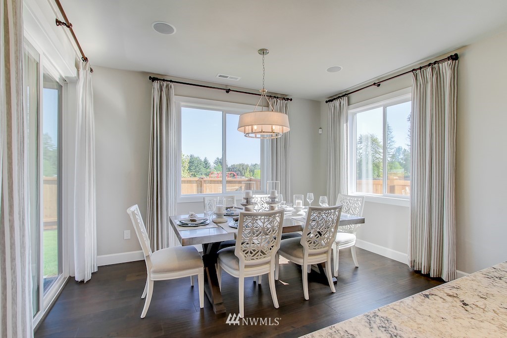 9779 Prospect Place Gig Harbor, WA 98332 - Photo 6 of 22 a dining room with furniture window wooden floor