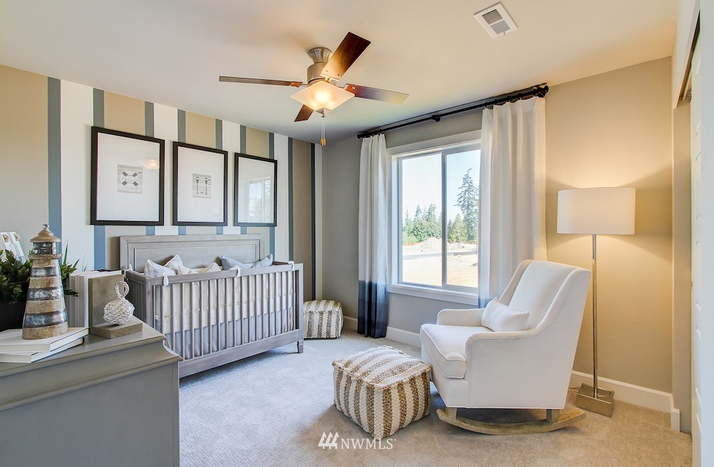 9779 Prospect Place Gig Harbor, WA 98332 - Photo 10 of 22 a bedroom with furniture and a large window