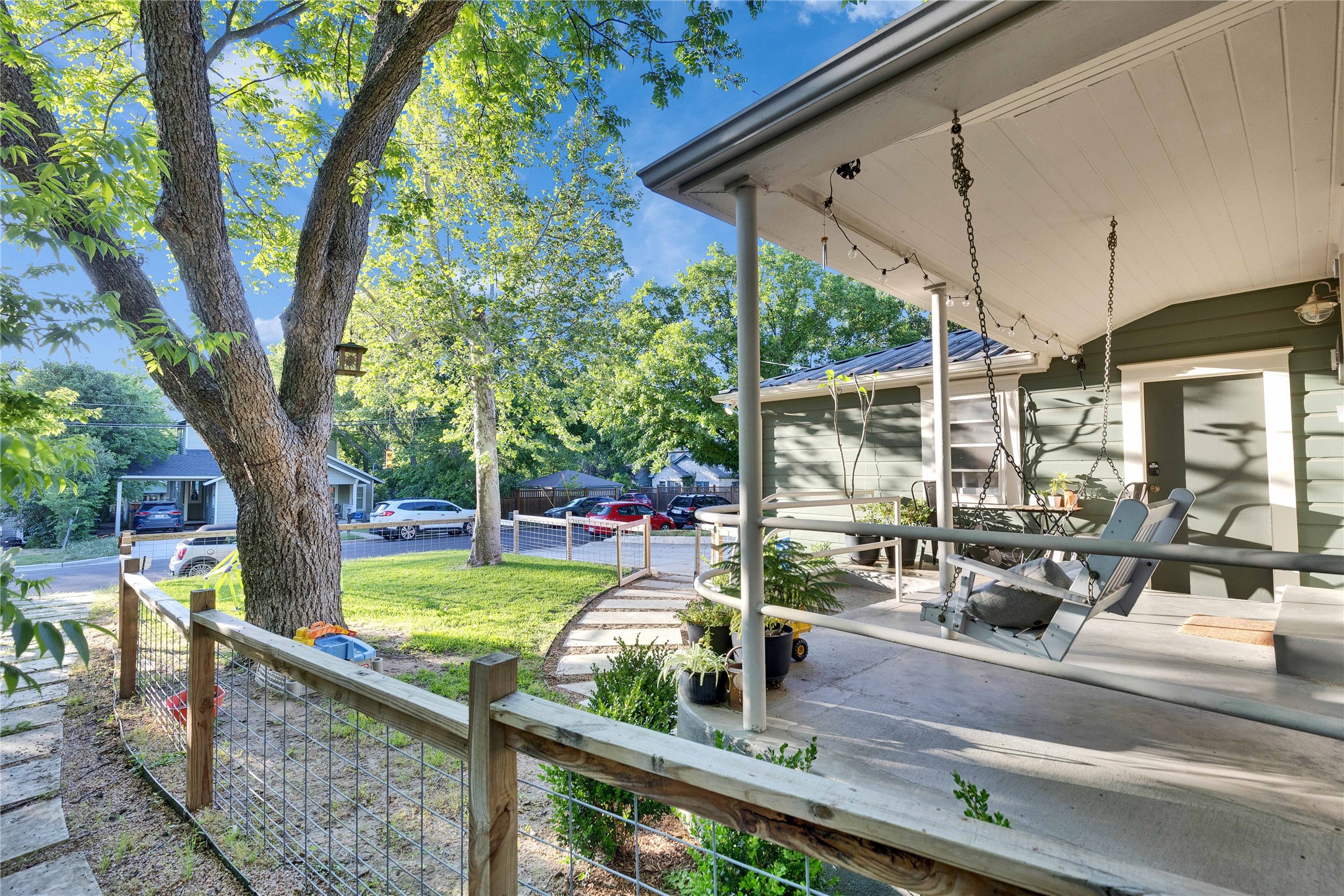4607 Evans Avenue, Unit B Austin, TX 78751 - Photo 33 of 34 Covered front porch featuring a porch swing and string lights