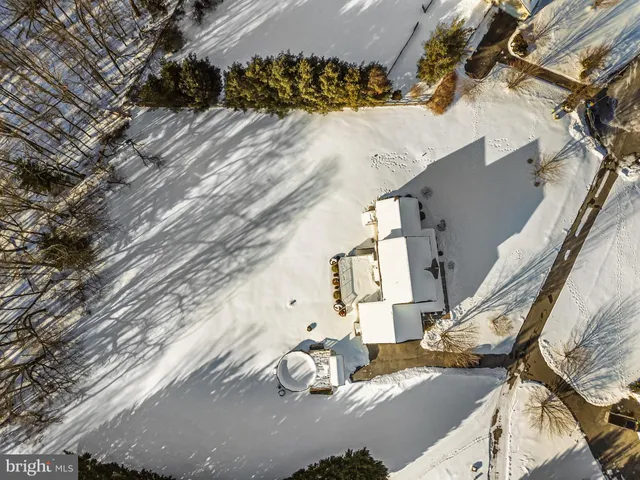 a bathroom with a sink mirror and toilet