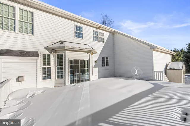 a bath tub sitting in a bathroom next to a window
