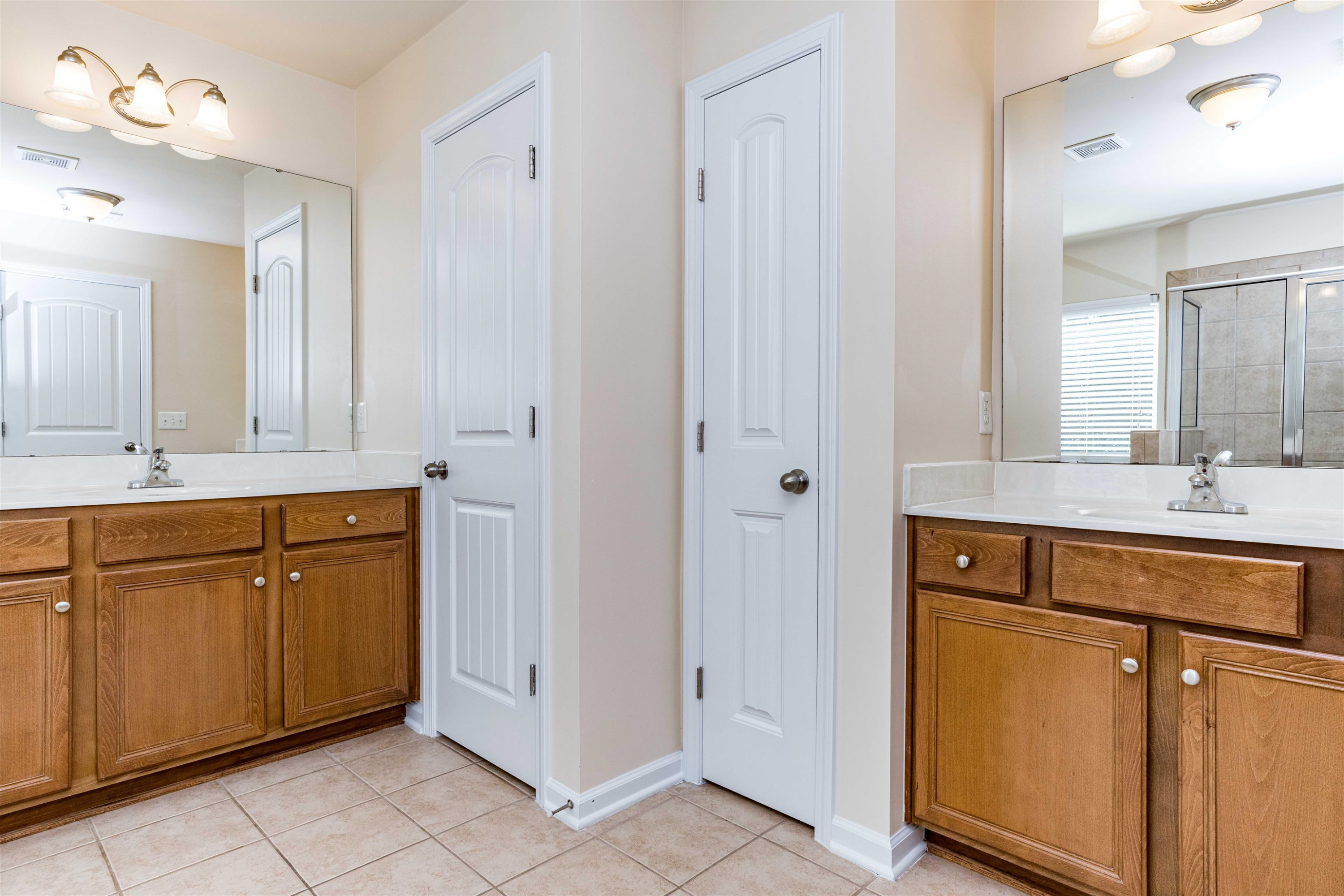 2081 Weston Green Loop Cary, NC 27513 - Photo 19 of 29 a bathroom with a sink vanity and mirror