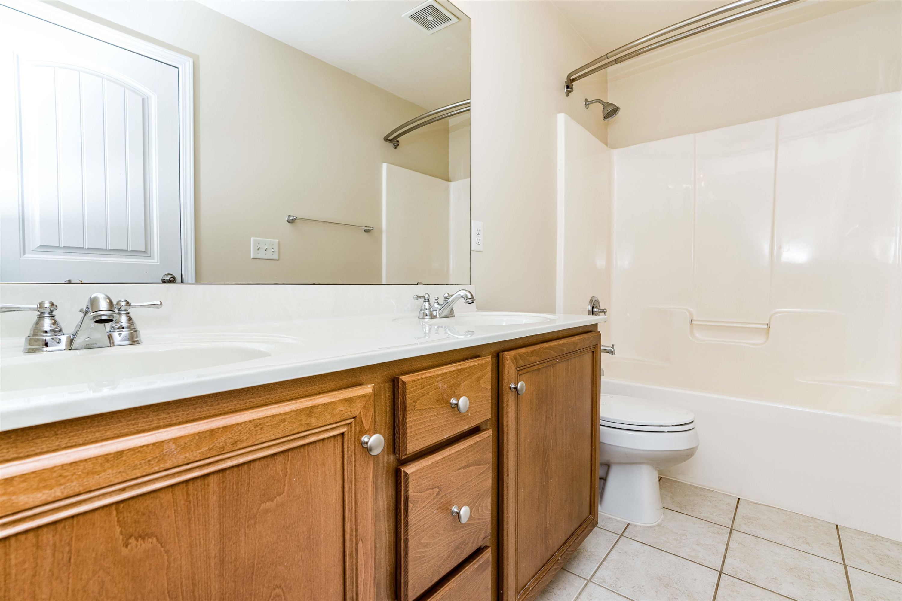 2081 Weston Green Loop Cary, NC 27513 - Photo 22 of 29 a bathroom with a granite countertop sink a toilet a mirror and shower