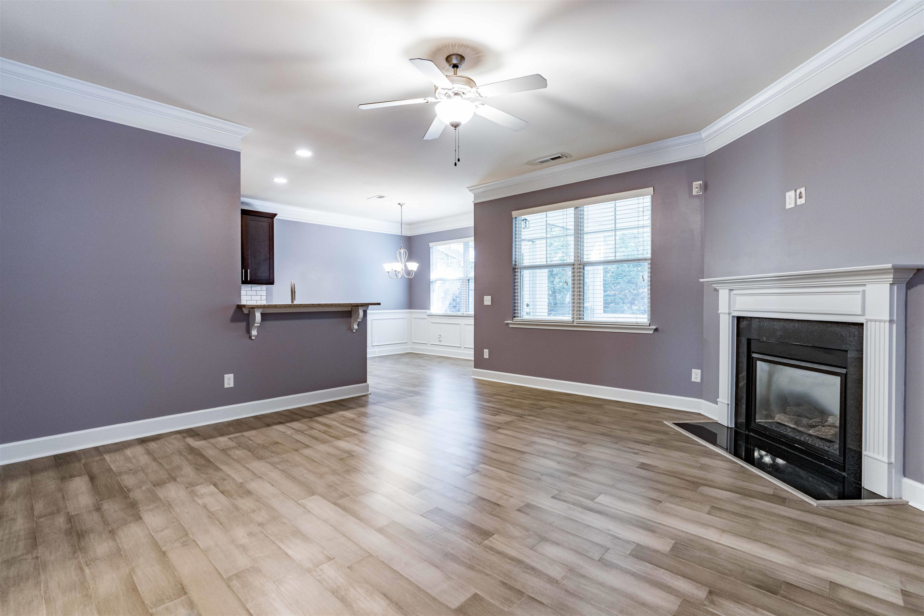 2081 Weston Green Loop Cary, NC 27513 - Photo 3 of 29 a view of an empty room with a fireplace and a window