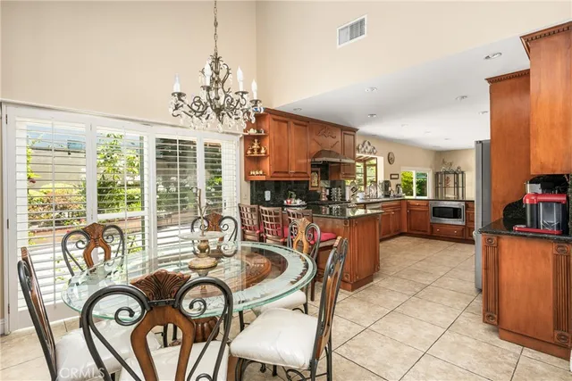 a kitchen with stainless steel appliances granite countertop a sink and cabinets