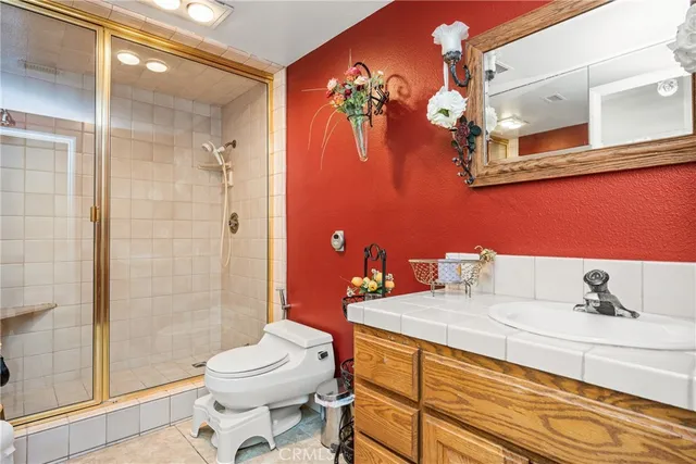 a view of a hallway with wooden floor and windows