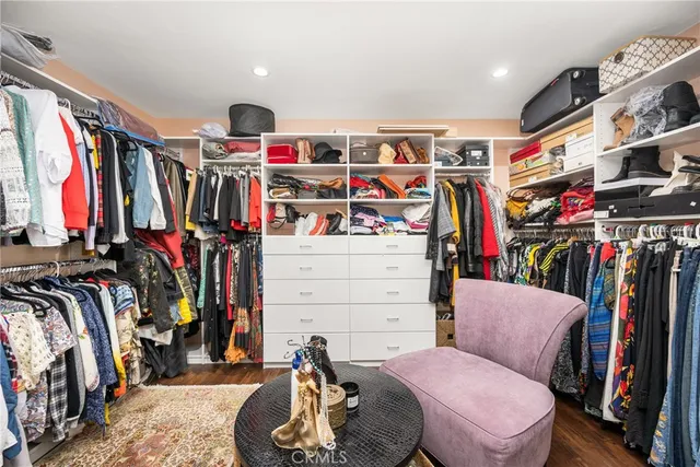 a bathroom with double vanity and a mirror