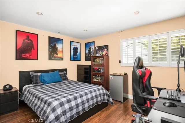 a bedroom with a bed and a dresser