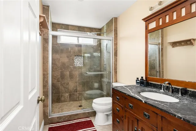 a view of a patio with table and chairs under an umbrella