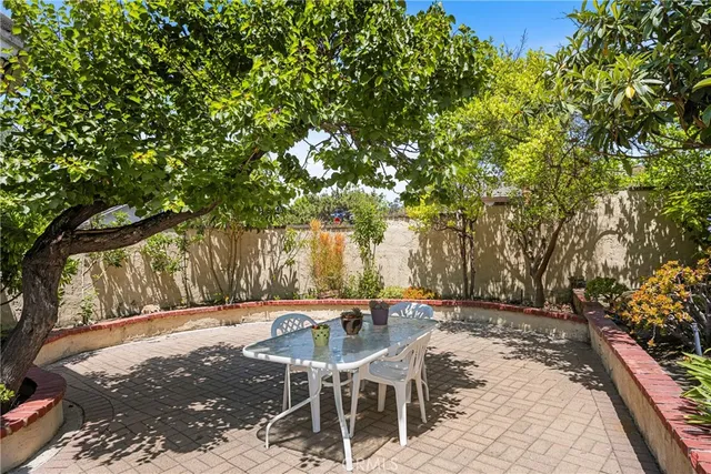 a view of a chairs and tables in the patio