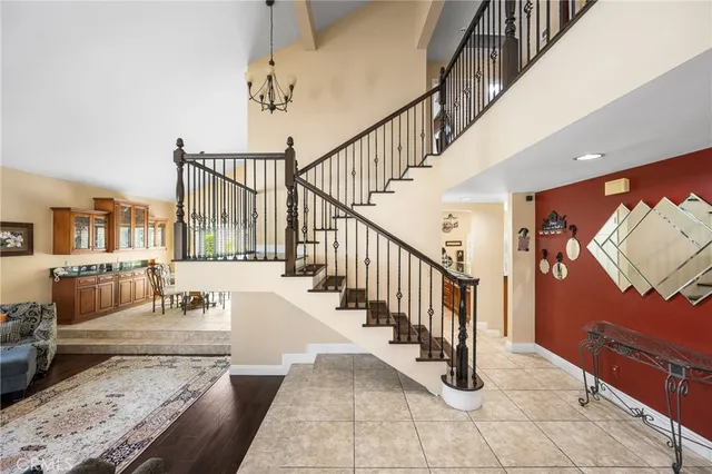 a view of living room with furniture and a fireplace