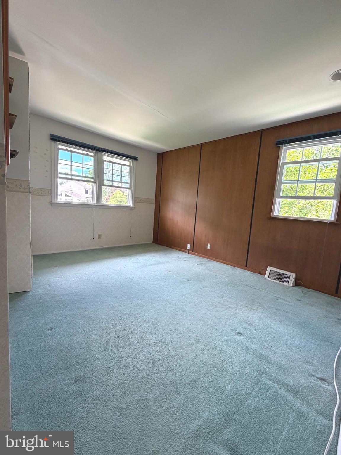 1207 Greenhill Road Flourtown, PA 19031 - Photo 8 of 9 an empty room with windows