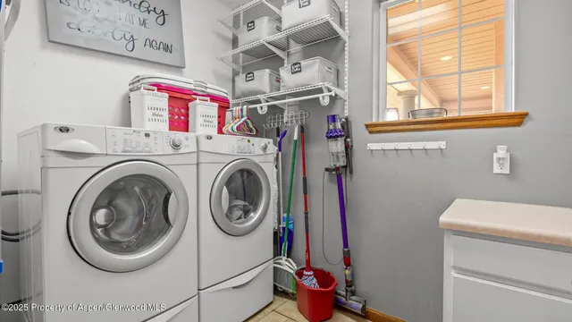 a utility room with dryer and washer