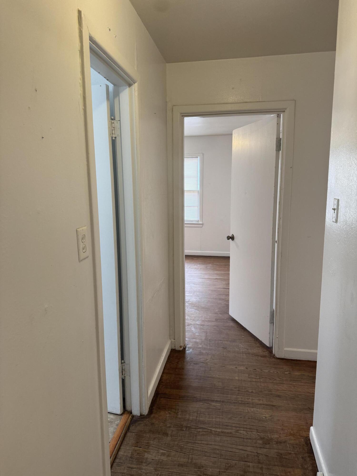 2514 43rd Street Lubbock, TX 79413 - Photo 5 of 8 a view of a hallway with wooden floor