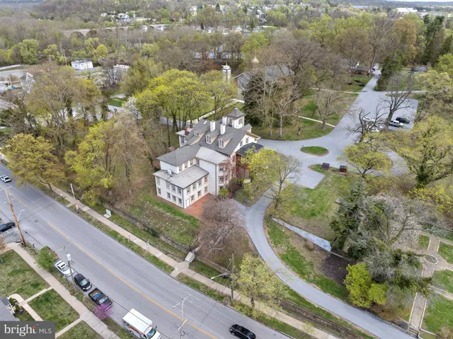 an aerial view of residential houses with outdoor space