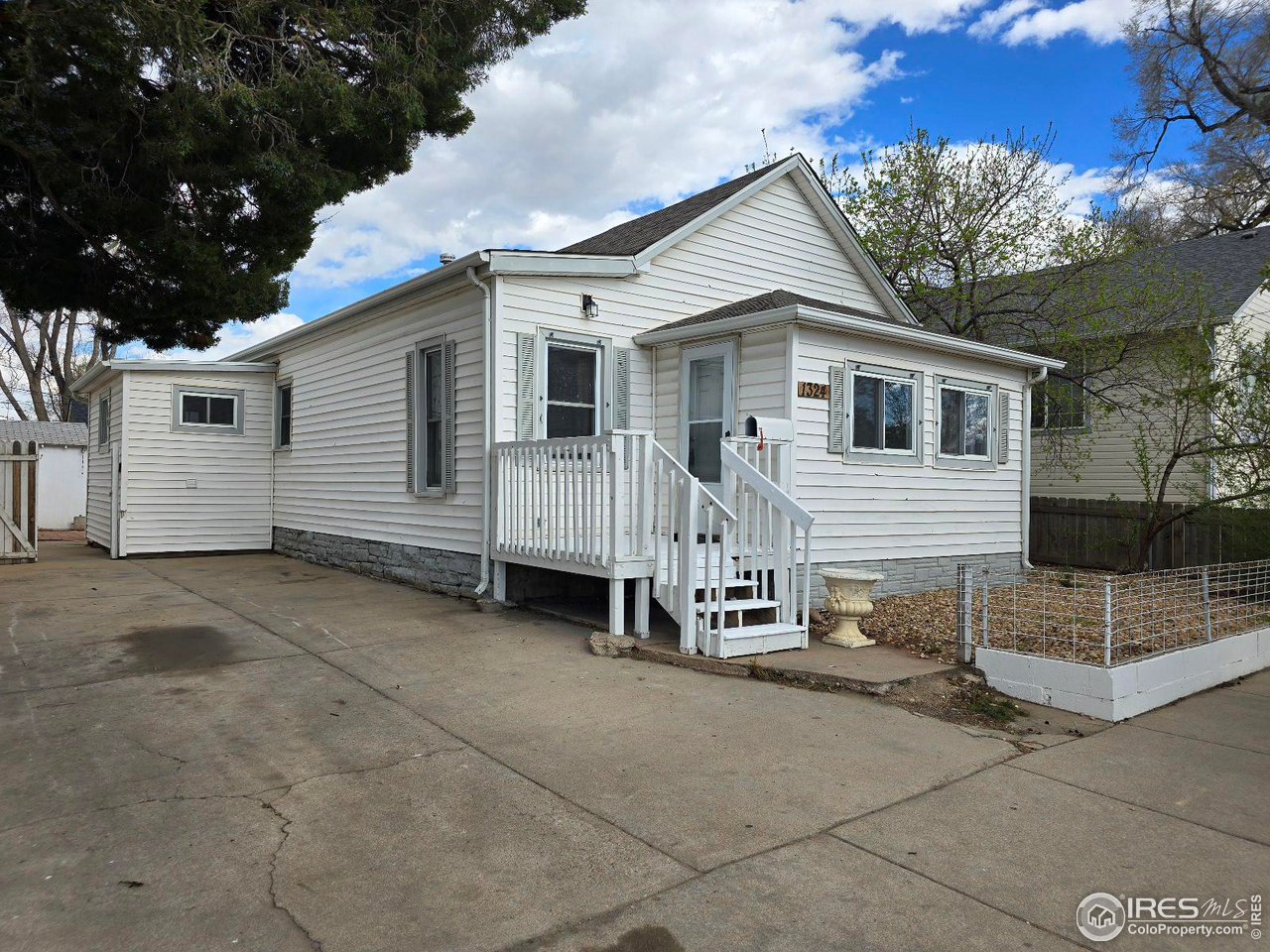a view of a house with a yard and garage