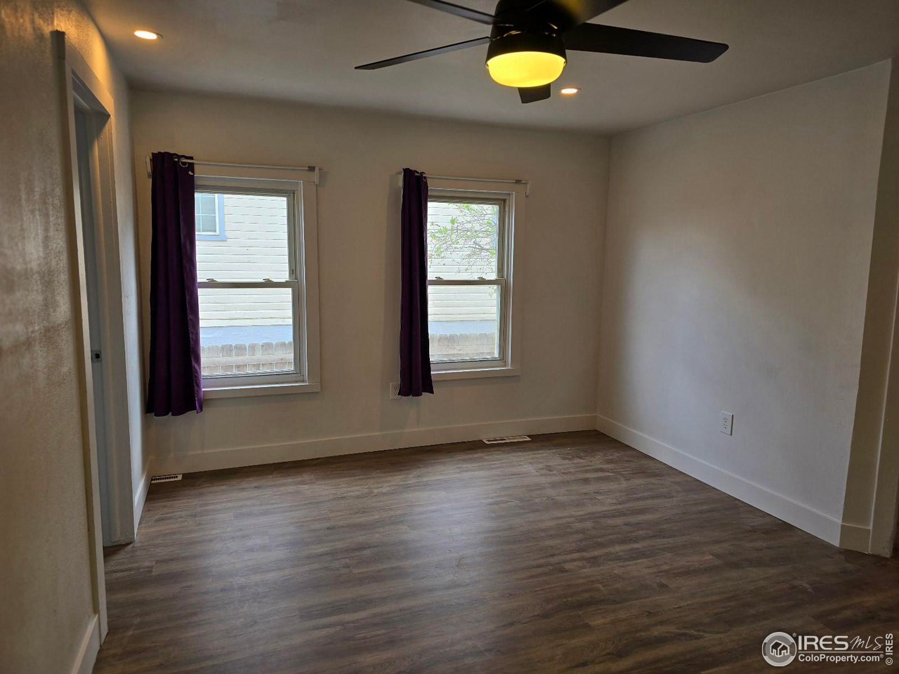 1324 7th Avenue Greeley, CO 80631 - Photo 11 of 22 an empty room with a window