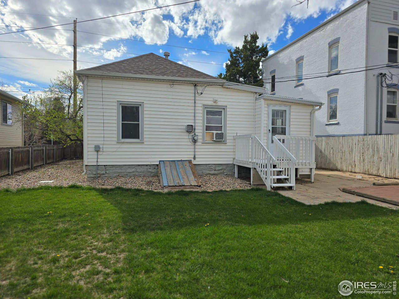 1324 7th Avenue Greeley, CO 80631 - Photo 21 of 22 a view of a house with a backyard