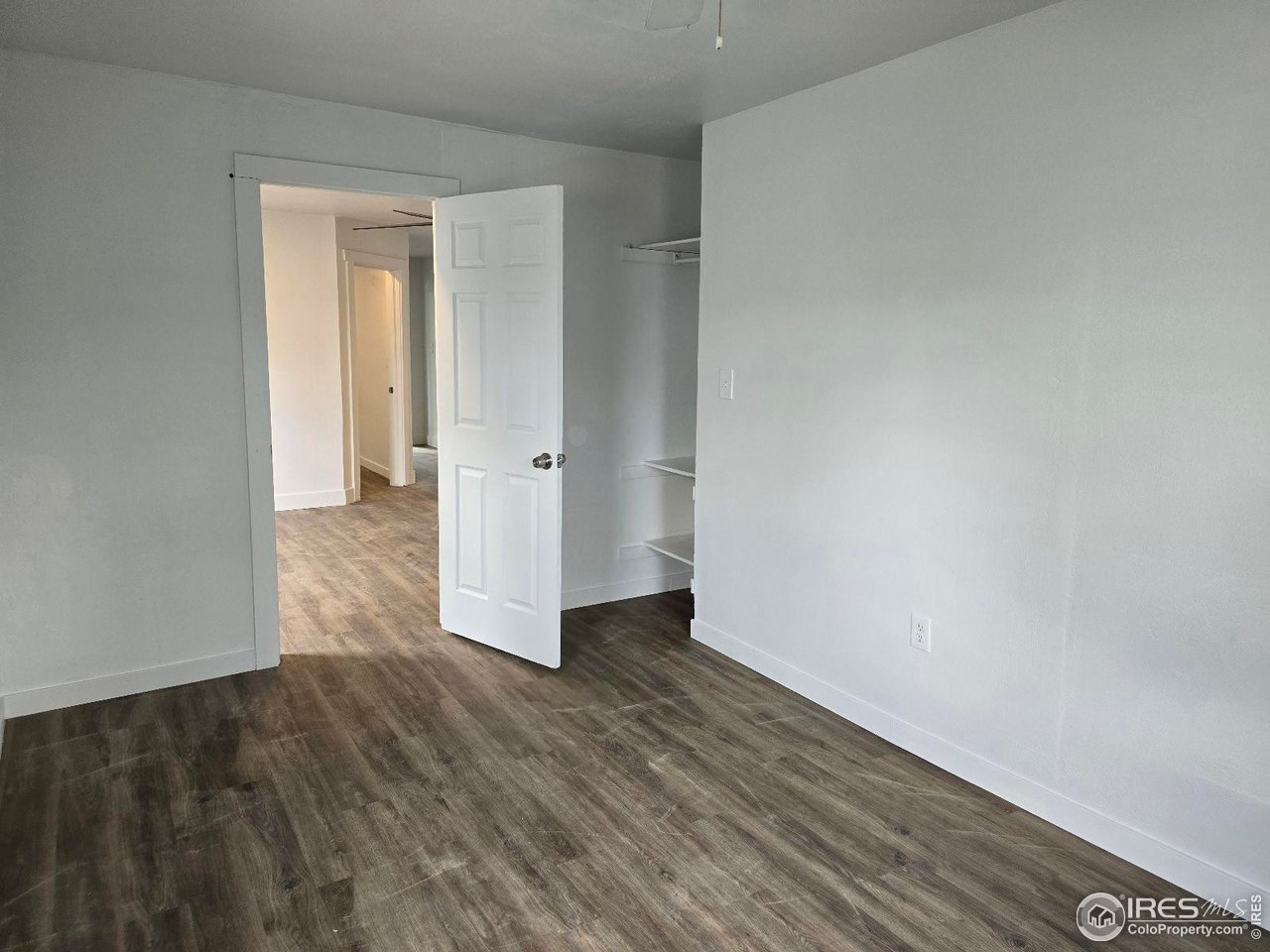 1324 7th Avenue Greeley, CO 80631 - Photo 6 of 22 a view of wooden floor in an empty room