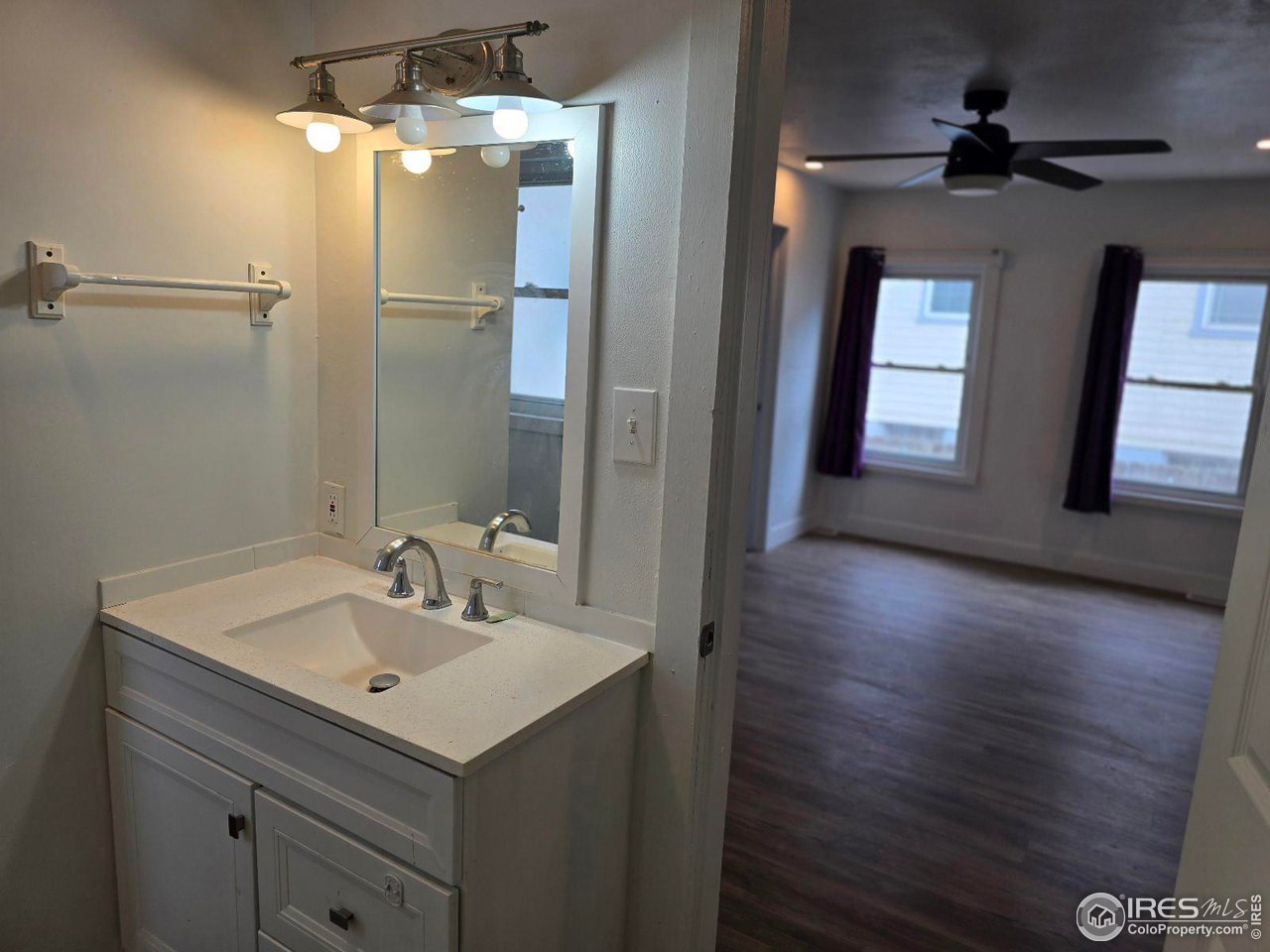 1324 7th Avenue Greeley, CO 80631 - Photo 9 of 22 a bathroom with a sink shower and a mirror