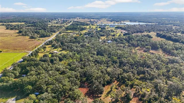 a view of an ocean beach and mountain