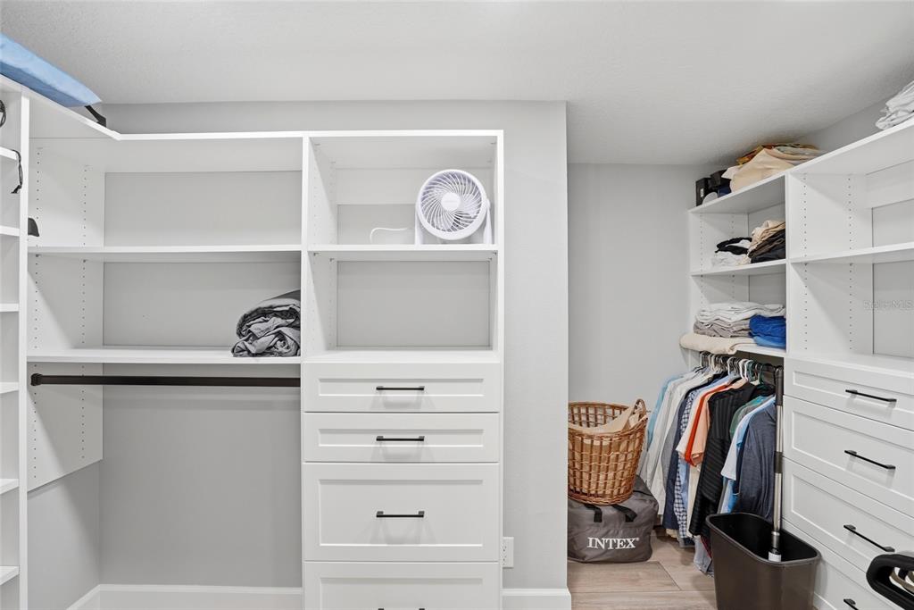 363 Pinellas Bayway South, Unit 29 Tierra Verde, FL 33715 - Photo 25 of 59 a view of walk in closet with clothes and shoes