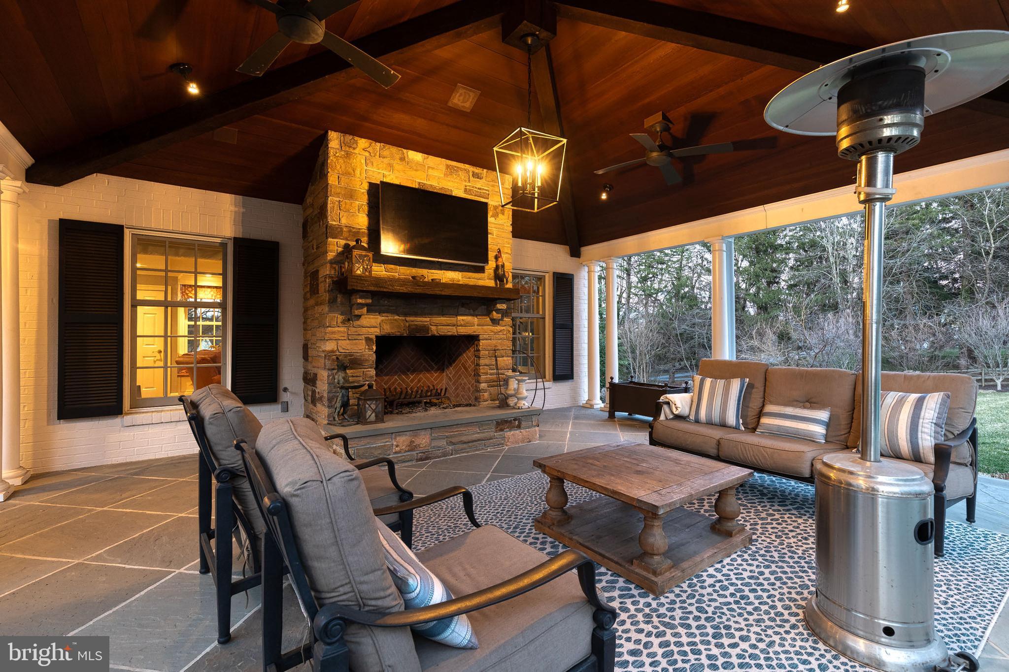 1719 Thornton Ridge Road Baltimore, MD 21204 - Photo 20 of 36 a outdoor space with patio couches and a fireplace