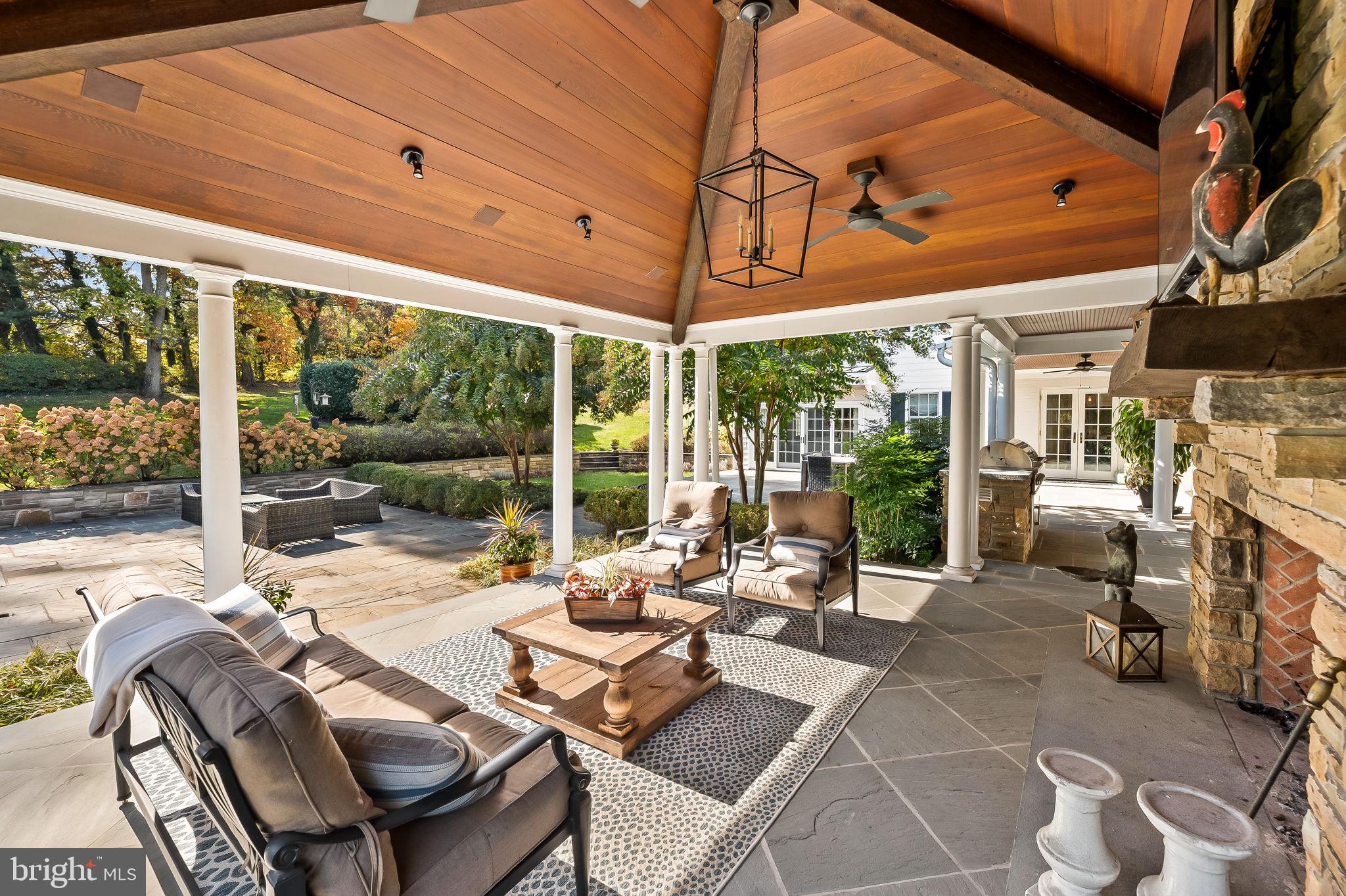 1719 Thornton Ridge Road Baltimore, MD 21204 - Photo 22 of 36 a view of a patio with a dining table and chairs