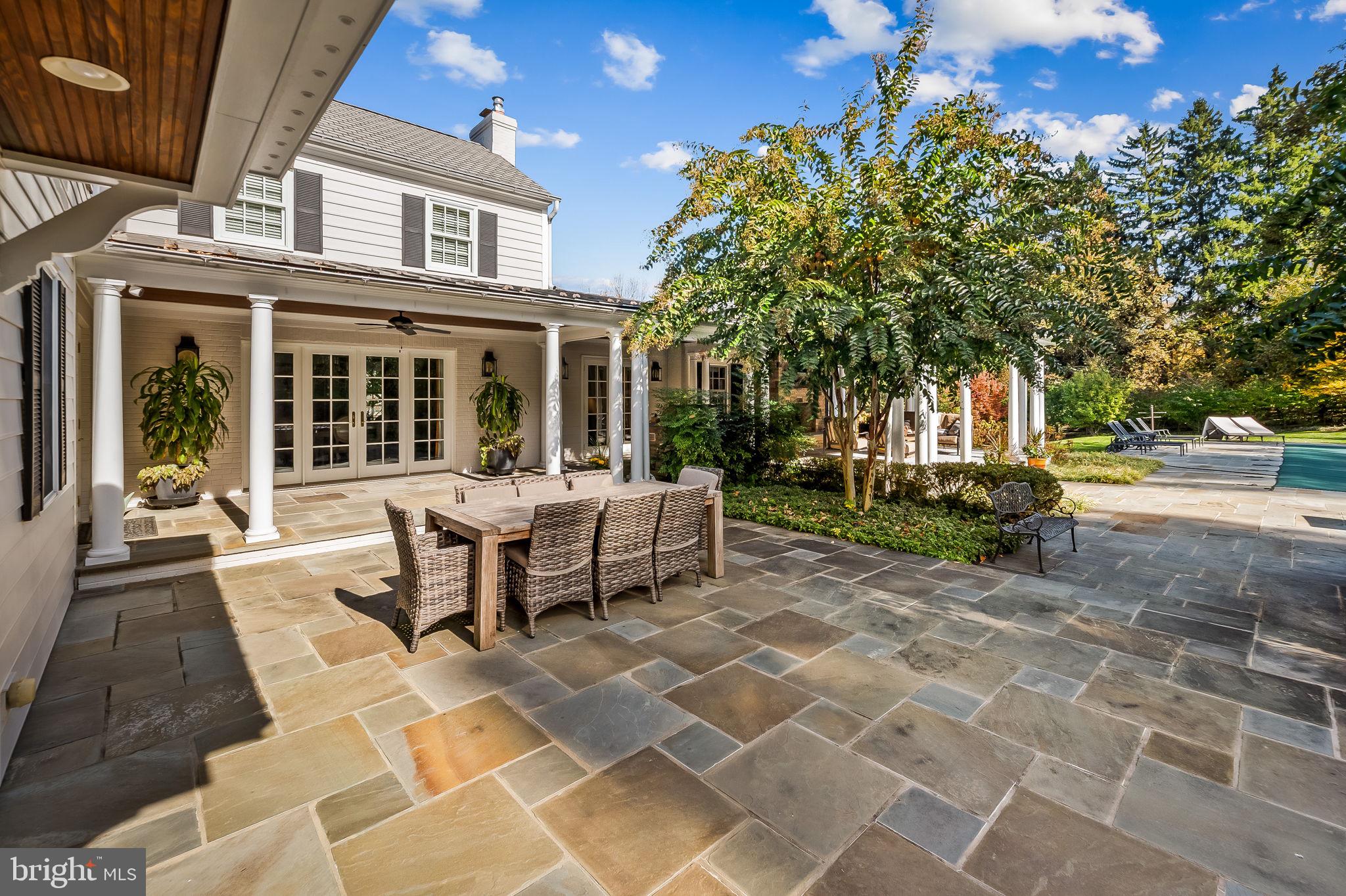 1719 Thornton Ridge Road Baltimore, MD 21204 - Photo 23 of 36 a view of a patio with table and chairs and potted plants