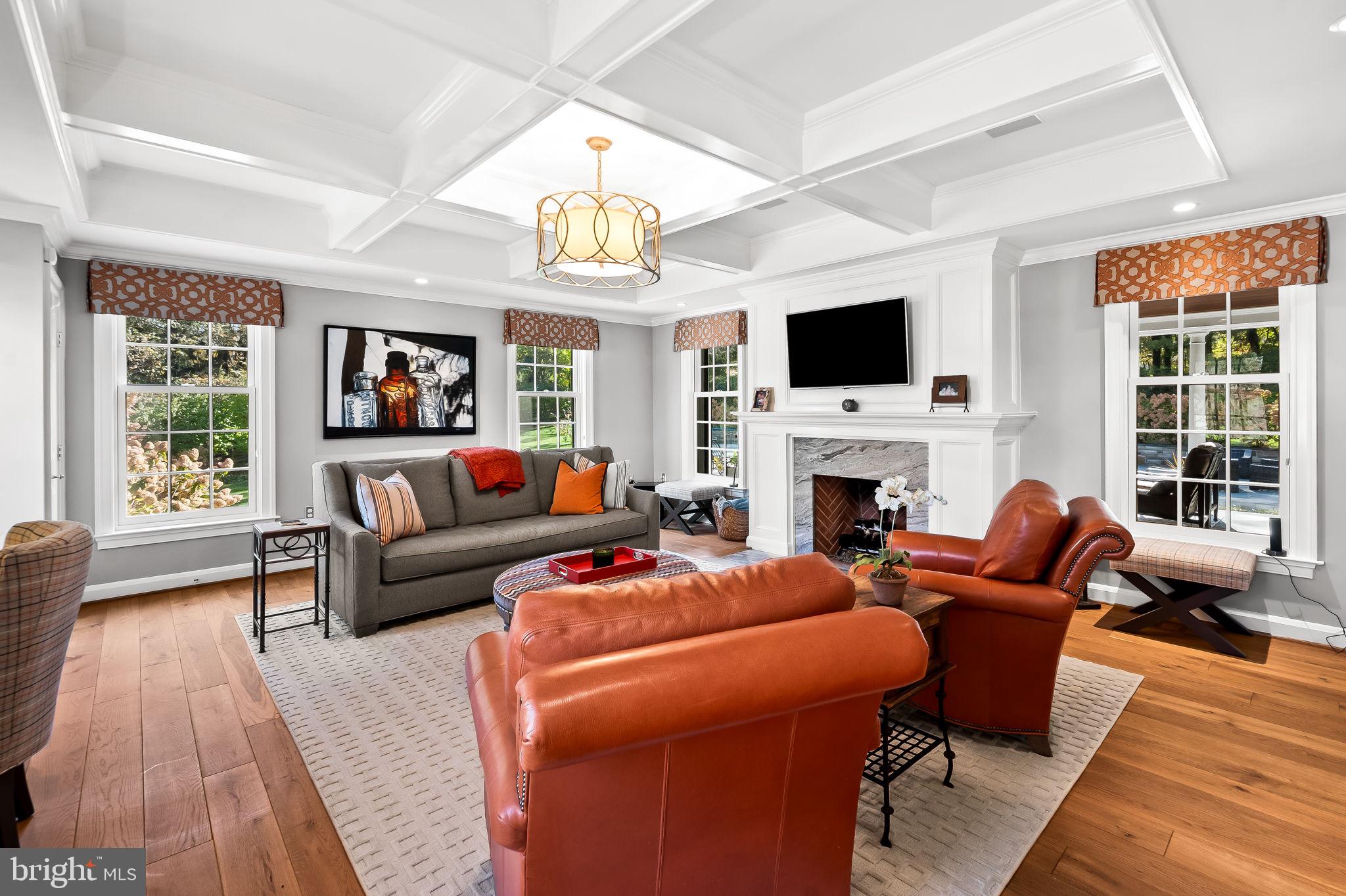 1719 Thornton Ridge Road Baltimore, MD 21204 - Photo 24 of 36 a living room with furniture a flat screen tv and a fireplace