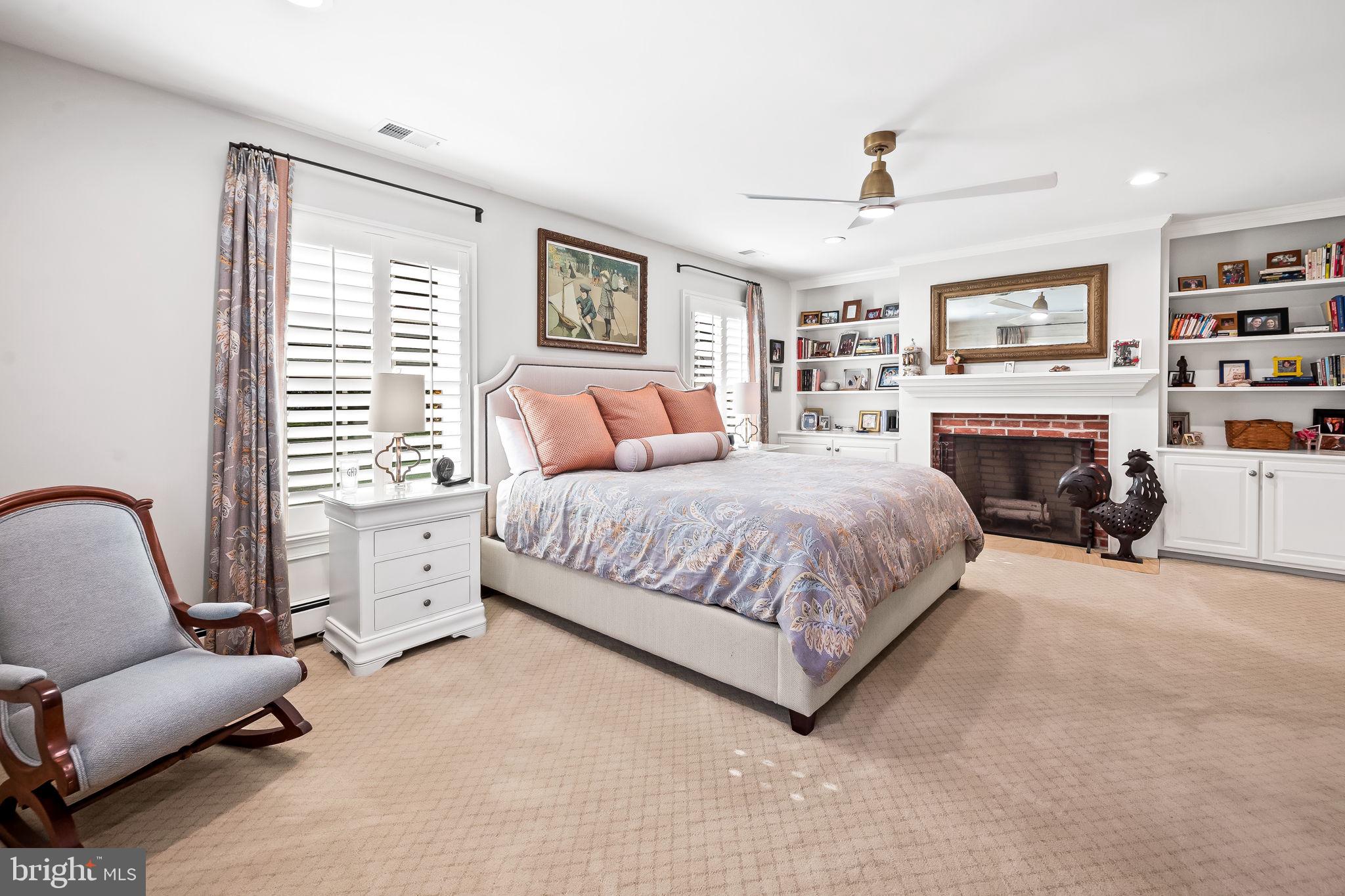 1719 Thornton Ridge Road Baltimore, MD 21204 - Photo 27 of 36 a bedroom with a large bed couch and two windows