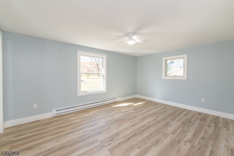 23 George Hill Road Augusta, NJ 07822 - Photo 14 of 19 a view of an empty room with wooden floor and a window