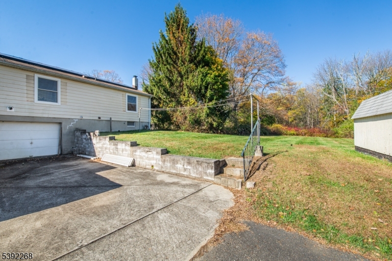 23 George Hill Road Augusta, NJ 07822 - Photo 19 of 19 a view of a house with backyard and trees