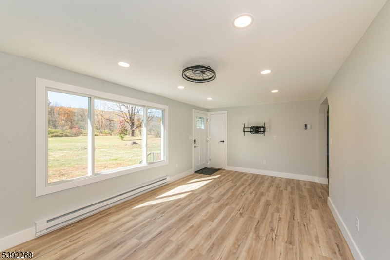 23 George Hill Road Augusta, NJ 07822 - Photo 10 of 19 a view of an empty room with wooden floor and a window