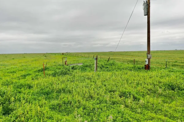a view of a big yard with an outdoor seating and deck