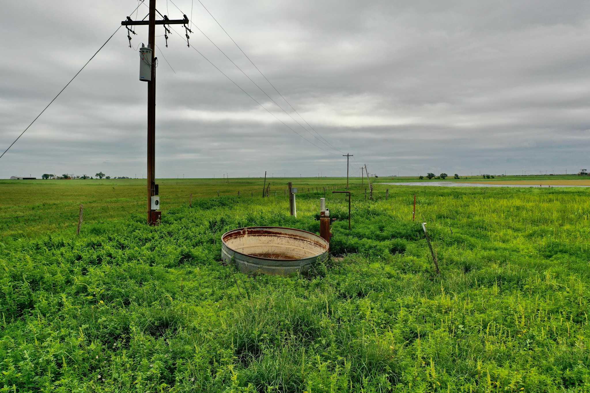 2015 County Road 9 Tulia, TX 79088 - Photo 16 of 33 a view of a garden with a table and chairs