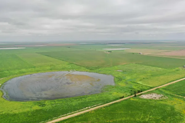 a view of a golf course with a field