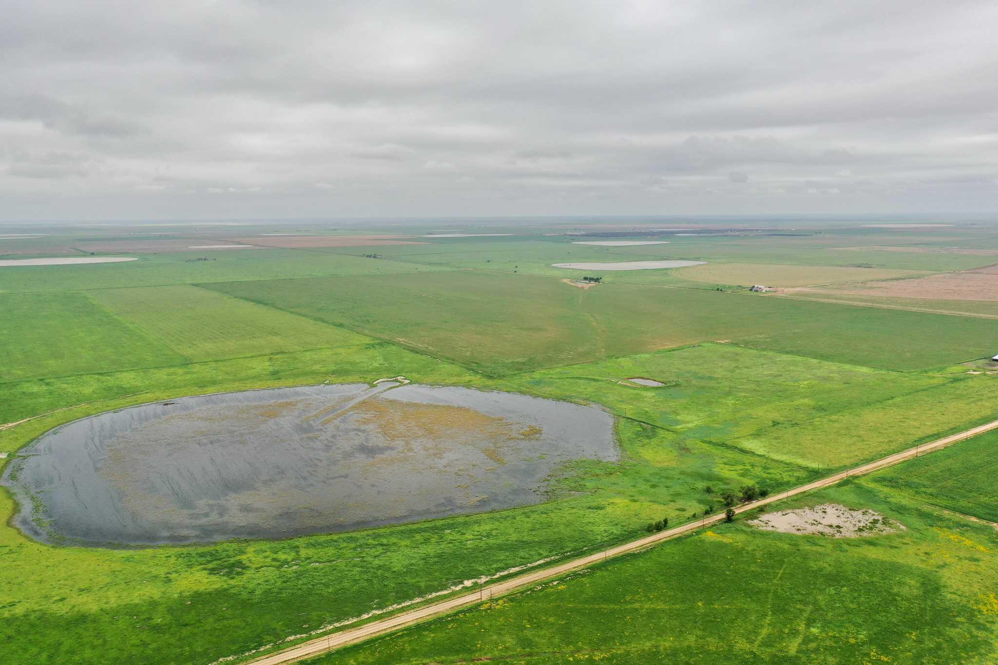 2015 County Road 9 Tulia, TX 79088 - Photo 2 of 33 a view of a golf course with a field